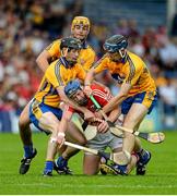 15 June 2014; Patrick Horgan, Cork, in action against Clare players, left to right, Patrick Donnellan, Peter Duggan and David McInerney. Munster GAA Hurling Senior Championship, Semi-Final, Clare v Cork, Semple Stadium, Thurles, Co. Tipperary. Picture credit: Dáire Brennan / SPORTSFILE