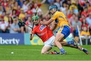 15 June 2014; Seamus Harnedy, Cork, is fouled by Brendan Bugler, Clare, which resulted in a penalty being awarded to Cork. Munster GAA Hurling Senior Championship, Semi-Final, Clare v Cork, Semple Stadium, Thurles, Co. Tipperary. Picture credit: Dáire Brennan / SPORTSFILE