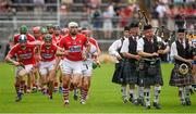 15 June 2014; The Cork captain Patrick Cronin and his team mates race to take their places after the traditional pre match parade. Munster GAA Hurling Senior Championship, Semi-Final, Clare v Cork, Semple Stadium, Thurles, Co. Tipperary. Picture credit: Ray McManus / SPORTSFILE