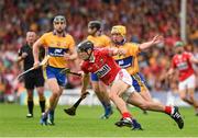 15 June 2014; Christopher Joyce, Cork, prepares to clear under pressure from Clare's Colm Galvin. Munster GAA Hurling Senior Championship, Semi-Final, Clare v Cork, Semple Stadium, Thurles, Co. Tipperary. Picture credit: Ray McManus / SPORTSFILE