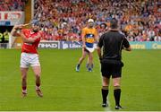 15 June 2014; Referee James McGrath watches as  Patrick Horgan, who scored 2-11 from placed balls for Cork, takes a 21 meter free. Munster GAA Hurling Senior Championship, Semi-Final, Clare v Cork, Semple Stadium, Thurles, Co. Tipperary. Picture credit: Ray McManus / SPORTSFILE