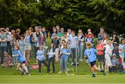 15 May 2014; Spectators watch Martha Byrne, right, Dublin, in action. Aisling McGing Ladies U21 Football Final, Dublin v Meath, Clane, Co. Kildare. Picture credit: Piaras Ó Mídheach / SPORTSFILE