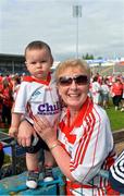 15 June 2014; Cork supporters Geraldine Downey, from Ballincollig, and her grand child Cathal, 12 months, after the game. Munster GAA Hurling Senior Championship, Semi-Final, Clare v Cork, Semple Stadium, Thurles, Co. Tipperary. Picture credit: Ray McManus / SPORTSFILE