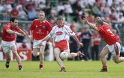 17 June 2006; Stephen O'Neill, Tyrone, in action against Peter McGinnity, left, Christy Grimes and Colin Goss, right, Louth. Bank of Ireland All-Ireland Senior Football Championship Qualifier, Round 1, Louth v Tyrone, Pairc Tailteann, Navan, Co. Meath. Picture credit: Brendan Moran / SPORTSFILE