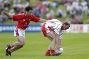 17 June 2006; Ger Cavlan, Tyrone, in action against Peter McGinnity, Louth. Bank of Ireland All-Ireland Senior Football Championship Qualifier, Round 1, Louth v Tyrone, Pairc Tailteann, Navan, Co. Meath. Picture credit: Brendan Moran / SPORTSFILE