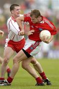 17 June 2006; Paddy Keenan, Louth, is tackled by Colin Holmes, Tyrone. Bank of Ireland All-Ireland Senior Football Championship Qualifier, Round 1, Louth v Tyrone, Pairc Tailteann, Navan, Co. Meath. Picture credit: Brendan Moran / SPORTSFILE