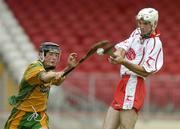 24 June 2006; Ryan Winters, Tyrone, has his shot blocked down by Danny Cullen, Donegal. Nicky Rackard Cup, Section 3A, Round 2, Tyrone v Donegal, Healy Park, Omagh, Co. Tyrone. Picture credit: Brendan Moran / SPORTSFILE