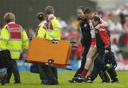 24 June 2006; Colin Holmes, Tyrone, leaves the field with an injury during the first half. Bank of Ireland All-Ireland Senior Football Championship Qualifier, Round 1 Replay, Tyrone v Louth, Healy Park, Omagh, Co. Tyrone. Picture credit: Brendan Moran / SPORTSFILE
