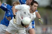 24 June 2006; Kevin O'Neill, Kildare, clears under pressure from Cavan players Michael Brides and Eddie O'Reilly. Bank of Ireland All-Ireland Senior Football Championship Qualifier, Round 1, Kildare v Cavan, St. Conleth's Park, Newbridge, Co. Kildare. Picture credit: Ray McManus / SPORTSFILE