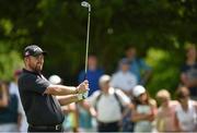 18 June 2014; Shane Lowry watches his second shot on the first fairway during the 2014 Irish Open Golf Championship Pro-Am. Fota Island, Cork. Picture credit: Diarmuid Greene / SPORTSFILE