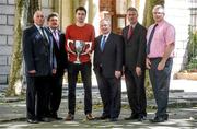 18 June 2014; Athlete Mark English, holding the Morton Mile Cup, with from left, Paddy Marley, President of Clonliffe Harriers A.C., John Foley, CEO of Athletics Ireland, Minister of State for Tourism and Sport Michael Ring T.D., Noel Guiden, from Clonliffe Harriers A.C, and Dave Conway, National Sports Campus, during the launch of the Morton Games 2014. Buswell's Hotel, Kildare Street, Dublin. Picture credit: Pat Murphy / SPORTSFILE