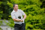 18 June 2014; Clare hurling manager Davy Fitzgerald watches his tee shot from the first teebox during the 2014 Irish Open Golf Championship Pro-Am. Fota Island, Cork. Picture credit: Matt Browne / SPORTSFILE