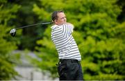 18 June 2014; Clare hurling manager Davy Fitzgerald watches his tee shot from the first teebox during the 2014 Irish Open Golf Championship Pro-Am. Fota Island, Cork. Picture credit: Matt Browne / SPORTSFILE