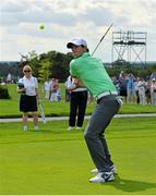 18 June 2014; Rory McIlroy hits a golf ball with a hurley on the 9th fairway during the 2014 Irish Open Golf Championship Pro-Am. Fota Island, Cork. Picture credit: Diarmuid Greene / SPORTSFILE