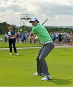 18 June 2014; Rory McIlroy hits a golf ball with a hurley on the 9th fairway during the 2014 Irish Open Golf Championship Pro-Am. Fota Island, Cork. Picture credit: Diarmuid Greene / SPORTSFILE