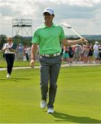 18 June 2014; Rory McIlroy after hitting a golf ball with a hurley on the 9th fairway during the 2014 Irish Open Golf Championship Pro-Am. Fota Island, Cork. Picture credit: Diarmuid Greene / SPORTSFILE