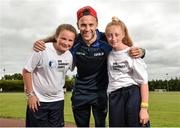 19 June 2014; Dublin footballer Jonny Cooper, with Rebecca Scurry, aged 13, from Dublin City, and Stephanie Hendrick, aged 14, from Ballymun, Dublin, in attendance at the annual GPA Community Camp in ALSAA, Dublin. The Camp, which is overseen by county players, is run for children from disadvantaged schools and this year is being run in conjunction with the SOAR organisation. ALSAA Sports Centre, Old Airport Road, Dublin. Picture credit: Barry Cregg / SPORTSFILE