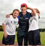 19 June 2014; Dublin footballer Jonny Cooper, with Rebecca Scurry, aged 13, from Dublin City, and Stephanie Hendrick, aged 14, from Ballymun, Dublin, in attendance at the annual GPA Community Camp in ALSAA, Dublin. The Camp, which is overseen by county players, is run for children from disadvantaged schools and this year is being run in conjunction with the SOAR organisation. ALSAA Sports Centre, Old Airport Road, Dublin. Picture credit: Barry Cregg / SPORTSFILE
