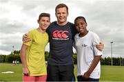19 June 2014; GPA CEO Dessie Farrell, with David Dykas, left, aged 14, and Collins Melekwe, aged 13, both from Dublin City, in attendance at the annual GPA Community Camp in ALSAA, Dublin. The Camp, which is overseen by county players, is run for children from disadvantaged schools and this year is being run in conjunction with the SOAR organisation. ALSAA Sports Centre, Old Airport Road, Dublin. Picture credit: Barry Cregg / SPORTSFILE