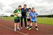 19 June 2014; Dublin footballer Jonny Cooper, with, left to right, Devin Maher, aged 13, Ciaran McDonald, aged 13, and Christopher Cahill, aged 13, all from Dublin City, in attendance at the annual GPA Community Camp in ALSAA, Dublin. The Camp, which is overseen by county players, is run for children from disadvantaged schools and this year is being run in conjunction with the SOAR organisation. ALSAA Sports Centre, Old Airport Road, Dublin. Picture credit: Barry Cregg / SPORTSFILE