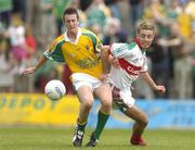 25 June 2006; Brian Gibbons, Mayo, in action against Conor Sheridan, Leitrim. Connacht Minor Football Championship, Semi-Final, Leitrim v Mayo, Sean McDiarmuid Park, Carrick-on-Shannon, Co. Leitrim. Picture credit: Pat Murphy / SPORTSFILE