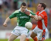 25 June 2006; Barry Owens, Fermanagh, in action against Enda McNulty, Armagh. Bank of Ireland Ulster Senior Football Championship, Semi-Final Replay, Armagh v Fermanagh, St. Tighearnach's Park, Clones, Co. Monaghan. Picture credit: David Maher / SPORTSFILE