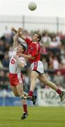 24 June 2006; Colin Holmes, Tyrone, contests a high ball with Paddy Keenan, Louth. Bank of Ireland All-Ireland Senior Football Championship Qualifier, Round 1 Replay, Tyrone v Louth, Healy Park, Omagh, Co. Tyrone. Picture credit: Brendan Moran / SPORTSFILE