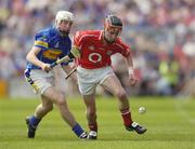 25 June 2006; Adrian Mannix, Cork, in action against Brendan Maher, Tipperary. Munster Minor Hurling Championship Final, Tipperary v Cork, Semple Stadium, Thurles, Co. Tipperary. Picture credit: Brendan Moran / SPORTSFILE