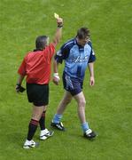 25 June 2006; Dublin's Kevin Bonner is shown the yellow card by referee Brian Crowe. Bank of Ireland Leinster Senior Football Championship, Semi-Final, Dublin v Laois, Croke Park, Dublin. Picture credit: Brian Lawless / SPORTSFILE