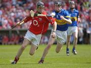 25 June 2006; Dan O'Callaghan, Cork, in action against Michael Cahill, Tipperary. Munster Minor Hurling Championship Final, Tipperary v Cork, Semple Stadium, Thurles, Co. Tipperary. Picture credit: Ray McManus / SPORTSFILE