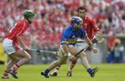 25 June 2006; Eoin Kelly, Tipperary, in action against Brian Murphy, left, and Sean Og O hAilpin, Cork. Guinness Munster Senior Hurling Championship Final, Tipperary v Cork, Semple Stadium, Thurles, Co. Tipperary. Picture credit: Brendan Moran / SPORTSFILE