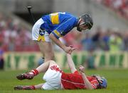25 June 2006; Paul Curran, Tipperary, checks on the wellbeing of Cian O'Connor, Cork, before O'Connor had to be substituted with an injury. Guinness Munster Senior Hurling Championship Final, Tipperary v Cork, Semple Stadium, Thurles, Co. Tipperary. Picture credit: Brendan Moran / SPORTSFILE