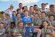 20 June 2014; DDSL captain Charlie Barry celebrates with his team-mates and the cup after the game. SFAI Kennedy Cup Final, DDSL v WSFL, University of Limerick, Limerick. Picture credit: Piaras Ó Mídheach / SPORTSFILE