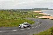 21 June 2014; Michael Dunlop and James McNulty, Ford Escort, in action during SS 8 at the Donegal International Rally, Knockalla, Portsalon, Co. Donegal. Picture credit: Barry Cregg / SPORTSFILE