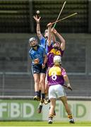 21 June 2014; Eoghan McHugh, Dublin, rises highest to claim a high ball, above team-mate Dónal Burke in and Wexford's Aaron Maddock as Cathal Dunbar, looks on. Electric Ireland Leinster Minor Hurling Championship, Semi-Final, Dublin v Wexford, Parnell Park, Dublin. Picture credit: Piaras Ó Mídheach / SPORTSFILE