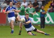 21 June 2014; Tommy McElroy, Fermanagh, in action against Denis Booth, Laois. GAA Football All-Ireland Senior Championship, Round 1A, Laois v Fermanagh, O’Moore Park, Portlaoise, Co. Laois. Picture credit: Pat Murphy / SPORTSFILE