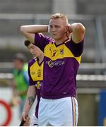 21 June 2014; A dejected Joe Coleman, Wexford, after the game. Electric Ireland Leinster Minor Hurling Championship, Semi-Final, Dublin v Wexford, Parnell Park, Dublin. Picture credit: Piaras Ó Mídheach / SPORTSFILE