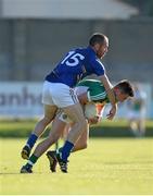21 June 2014; Eoin Carroll, Offaly, in action against Patrick McWalter, Wicklow. GAA Football All-Ireland Senior Championship, Round 1A, Wicklow v Offaly, Aughrim GAA Grounds, Aughrim, Co. Wicklow. Picture credit: Dáire Brennan / SPORTSFILE