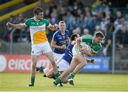 21 June 2014; Joe Maher, right, and Niall Smith, Offaly, in action against Alan Byrne, Wicklow. GAA Football All-Ireland Senior Championship, Round 1A, Wicklow v Offaly, Aughrim GAA Grounds, Aughrim, Co. Wicklow. Picture credit: Dáire Brennan / SPORTSFILE