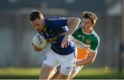 21 June 2014; Paul Earls, Wicklow, in action against Joseph O'Connor, Offaly. GAA Football All-Ireland Senior Championship, Round 1A, Wicklow v Offaly, Aughrim GAA Grounds, Aughrim, Co. Wicklow. Picture credit: Dáire Brennan / SPORTSFILE