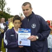 24 June 2006; Eoin Smyth, East Meath captain, is presented with a team certificate by Republic of Ireland goalkeeper Shay Given after the Danone Nations Cup. AUL Complex, Clonshaugh, Dublin. Picture credit: Pat Murphy / SPORTSFILE