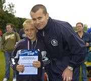 24 June 2006; Conor Frinch, Wicklow Rovers captain, is presented with a team certificate by Republic of Ireland goalkeeper Shay Given after the Danone Nations Cup. AUL Complex, Clonshaugh, Dublin. Picture credit: Pat Murphy / SPORTSFILE