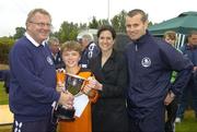 24 June 2006; Colman Kennedy, Clonmel Town, is presented with the Danone Nations Cup National Final trophy by, from left, Pat Kelly, FAI, Anne-Claire Monde, Danone, and Republic of Ireland goalkeeper Shay Given during the Danone Nations Cup National Finals. AUL Complex, Clonshaugh, Dublin. Picture credit: Pat Murphy / SPORTSFILE