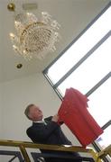 29 June 2006; John O'Donoghue, T.D., Minister for Arts, Sport and Tourism, who today opened the prestigious World Golf Hall of Fame exhibit at Waterford Crystal, the official sponsor of the 2006 Ryder Cup, admires the historic captains shirt worn by Jack Nicklaus on the day Europe finally won the 1987 Ryder Cup on U.S. soil after 60 years of trying. Waterford Crystal Visitor Centre, Waterford Crystal, Waterford. Picture credit: Brian Lawless / SPORTSFILE