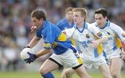1 July 2006; Damian O'Brien, Tipperary, in action against Noel Farrell, and Arthur O'Connor, right, Longford. Bank of Ireland All-Ireland Senior Football Championship Qualifier, Round 2, Longford v Tipperary, Pearse Park, Longford. Picture credit: Pat Murphy / SPORTSFILE