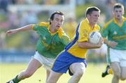 1 July 2006; Gerry Lohan, Roscommon, in action against Anthony Moyles, Meath. Bank of Ireland All-Ireland Senior Football Championship Qualifier, Round 2, Meath v Roscommon, Pairc Tailteann, Navan, Co. Meath. Picture credit: David Maher / SPORTSFILE