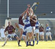 1 July 2006; Laois pair James Young and Joe Fitzpatrick in action against Westmeath pair John Shaw and Brian Connaughton. Guinness All-Ireland Senior Hurling Championship Qualifier, Round 2, Westmeath v Laois, Cusack Park, Mullingar, Co. Westmeath. Picture credit: Damien Eagers / SPORTSFILE