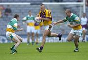 2 July 2006; Rory Stafford, Wexford, in action against Karol Slattery, left and Alan McNamee, Offaly. Bank of Ireland Leinster Senior Football Championship Semi-Final, Offaly v Wexford, Croke Park, Dublin. Picture credit: David Maher / SPORTSFILE