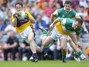 2 July 2006; Liam Murphy, Wexford, in action against Scott Brady, and Ciaran McManus, Offaly. Bank of Ireland Leinster Senior Football Championship Semi-Final, Offaly v Wexford, Croke Park, Dublin. Picture credit: David Maher / SPORTSFILE