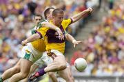 2 July 2006; Paddy Colfer, Wexford, in action against Scott Brady, Offaly. Bank of Ireland Leinster Senior Football Championship Semi-Final, Offaly v Wexford, Croke Park, Dublin. Picture credit: Pat Murphy / SPORTSFILE